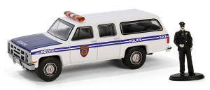 GREEN97160-D - GMC Suburban 2500 1985 Policía con figurita de la serie THE HOBBY SHOP en blister